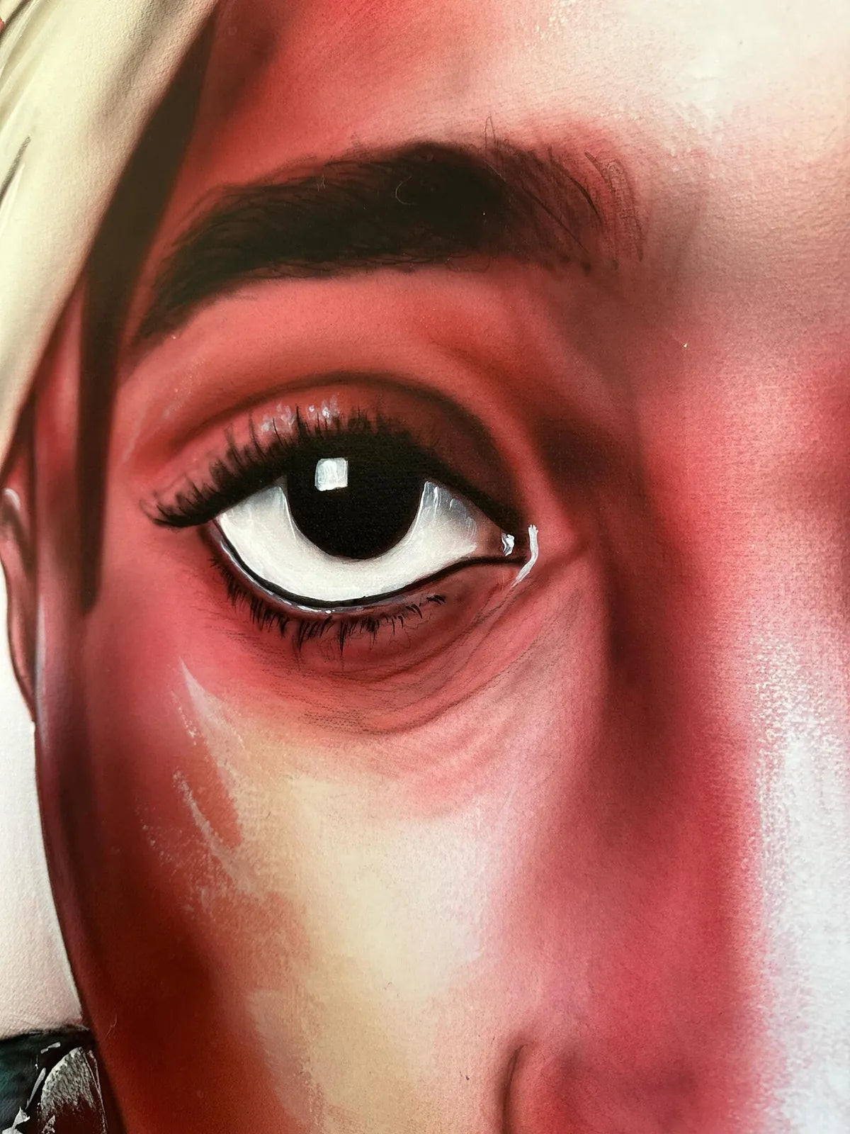 Detalle de un ojo pintado con aerógrafo